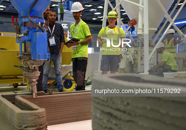 People visit 3D construction printing technology at the ConteQ Expo24 (Advanced Technology for Construction & Services Expo) at the Qatar Na...