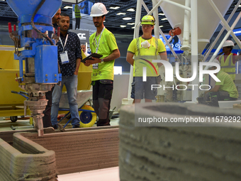 People visit 3D construction printing technology at the ConteQ Expo24 (Advanced Technology for Construction & Services Expo) at the Qatar Na...