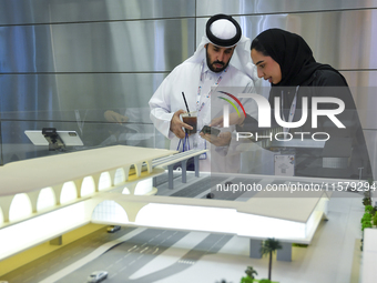 People visit the Qatar Rail booth during ConteQ Expo24 (Advanced Technology for Construction & Services Expo) at the Qatar National Conventi...