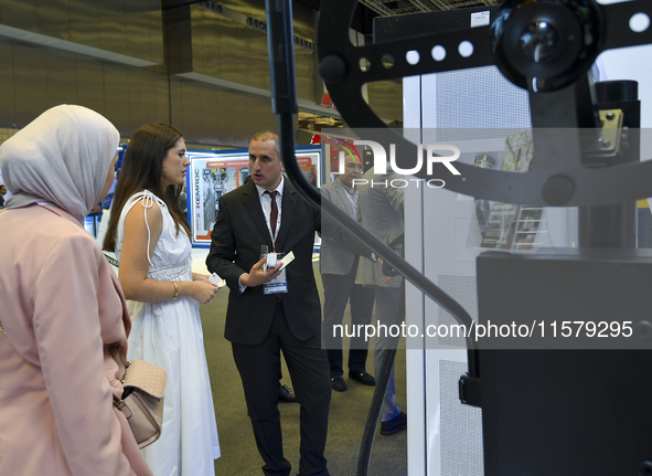 People visit the Traffic Tech booth during ConteQ Expo24 (Advanced Technology for Construction & Services Expo) at the Qatar National Conven...