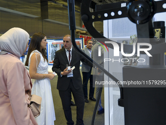 People visit the Traffic Tech booth during ConteQ Expo24 (Advanced Technology for Construction & Services Expo) at the Qatar National Conven...