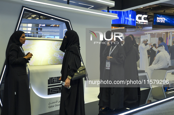 People visit the Qatar Public Works Authority booth during ConteQ Expo24 (Advanced Technology for Construction & Services Expo) at the Qatar...