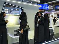 People visit the Qatar Public Works Authority booth during ConteQ Expo24 (Advanced Technology for Construction & Services Expo) at the Qatar...