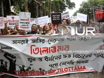 Teachers shout slogans during a protest rally against the rape and murder of a PGT woman doctor at the government-run R G Kar Medical Colleg...