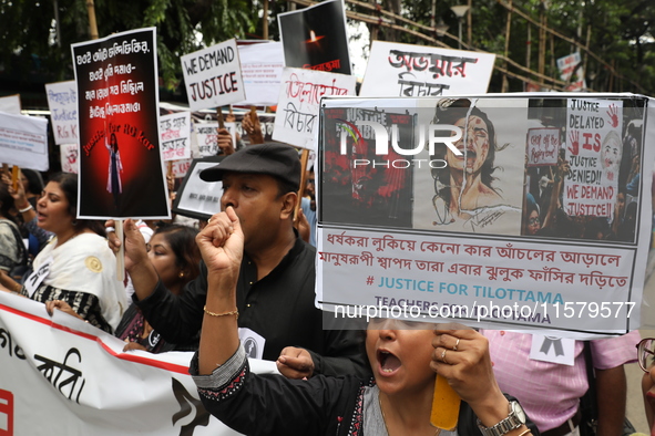 Teachers shout slogans during a protest rally against the rape and murder of a PGT woman doctor at the government-run R G Kar Medical Colleg...