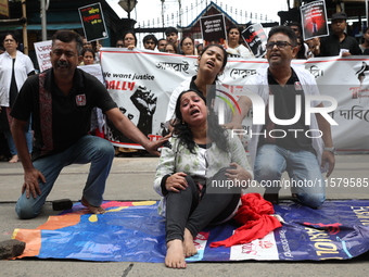 Artists perform a street play during a teachers' protest against the rape and murder of a PGT woman doctor at the government-run R G Kar Med...