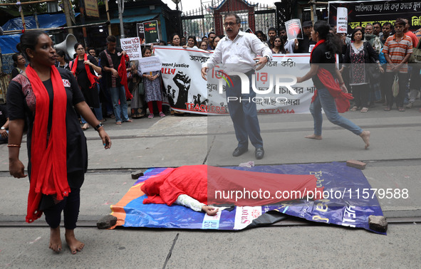 Artists perform a street play during a teachers' protest against the rape and murder of a PGT woman doctor at the government-run R G Kar Med...