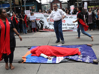 Artists perform a street play during a teachers' protest against the rape and murder of a PGT woman doctor at the government-run R G Kar Med...