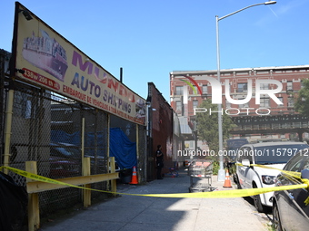 NYPD crime scene investigators search for evidence where a 32-year-old man is shot numerous times and killed in Manhattan, New York, United...