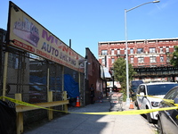 NYPD crime scene investigators search for evidence where a 32-year-old man is shot numerous times and killed in Manhattan, New York, United...