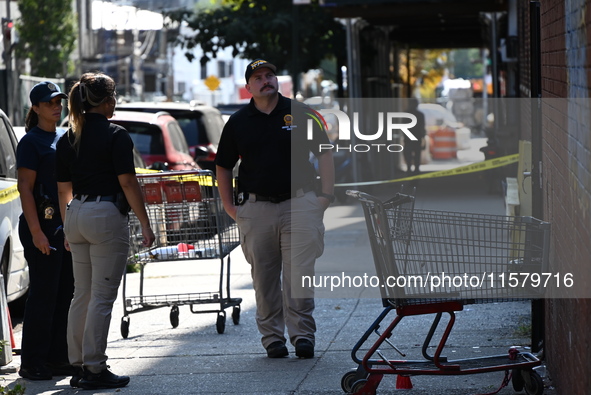 NYPD crime scene investigators search for evidence where a 32-year-old man is shot numerous times and killed in Manhattan, New York, United...