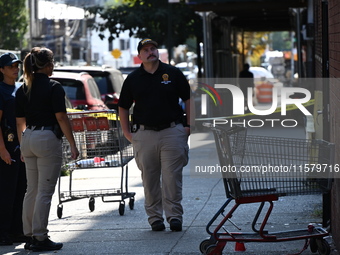 NYPD crime scene investigators search for evidence where a 32-year-old man is shot numerous times and killed in Manhattan, New York, United...