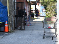 NYPD crime scene investigators search for evidence where a 32-year-old man is shot numerous times and killed in Manhattan, New York, United...