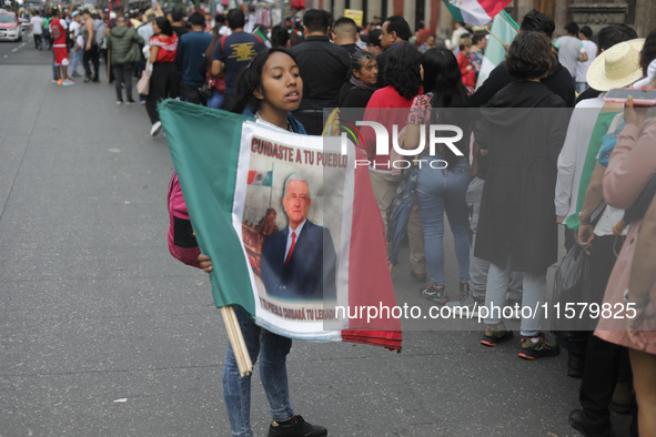 A person sells Mexican flags at Zocalo in the main square to celebrate the 214th Anniversary of Mexico's Independence Day in Mexico City, Me...