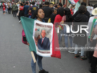 A person sells Mexican flags at Zocalo in the main square to celebrate the 214th Anniversary of Mexico's Independence Day in Mexico City, Me...