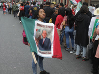 A person sells Mexican flags at Zocalo in the main square to celebrate the 214th Anniversary of Mexico's Independence Day in Mexico City, Me...