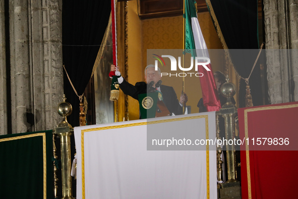 Mexico's President, Andres Manuel Lopez Obrador, waves the Mexican flag and makes his last shout of independence to commemorate the 214th an...