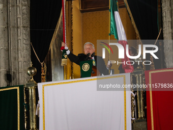 Mexico's President, Andres Manuel Lopez Obrador, waves the Mexican flag and makes his last shout of independence to commemorate the 214th an...