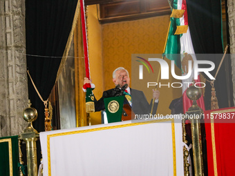 Mexico's President, Andres Manuel Lopez Obrador, waves the Mexican flag and makes his last shout of independence to commemorate the 214th an...