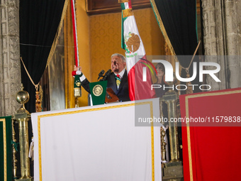 Mexico's President, Andres Manuel Lopez Obrador, waves the Mexican flag and makes his last shout of independence to commemorate the 214th an...