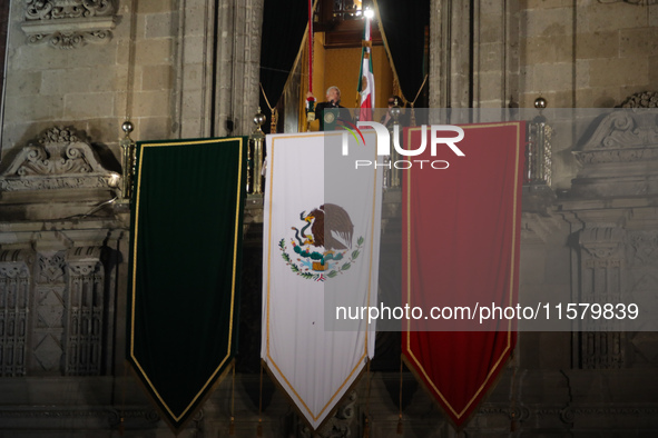 Mexico's President, Andres Manuel Lopez Obrador, waves the Mexican flag and makes his last shout of independence to commemorate the 214th an...