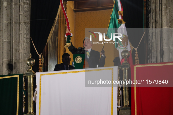 Mexico's President, Andres Manuel Lopez Obrador, waves the Mexican flag and makes his last shout of independence to commemorate the 214th an...