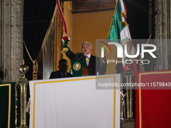 Mexico's President, Andres Manuel Lopez Obrador, waves the Mexican flag and makes his last shout of independence to commemorate the 214th an...