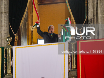 Mexico's President, Andres Manuel Lopez Obrador, waves the Mexican flag and makes his last shout of independence to commemorate the 214th an...