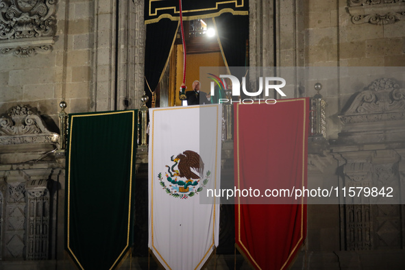 Mexico's President, Andres Manuel Lopez Obrador, waves the Mexican flag and makes his last shout of independence to commemorate the 214th an...