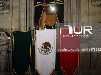 Mexico's President, Andres Manuel Lopez Obrador, waves the Mexican flag and makes his last shout of independence to commemorate the 214th an...