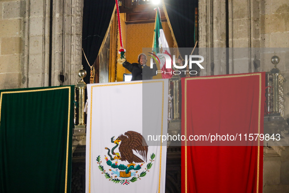 Mexico's President, Andres Manuel Lopez Obrador, waves the Mexican flag and makes his last shout of independence to commemorate the 214th an...