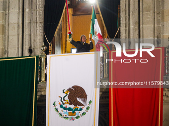 Mexico's President, Andres Manuel Lopez Obrador, waves the Mexican flag and makes his last shout of independence to commemorate the 214th an...