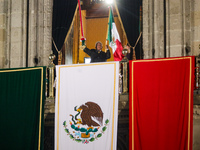 Mexico's President, Andres Manuel Lopez Obrador, waves the Mexican flag and makes his last shout of independence to commemorate the 214th an...