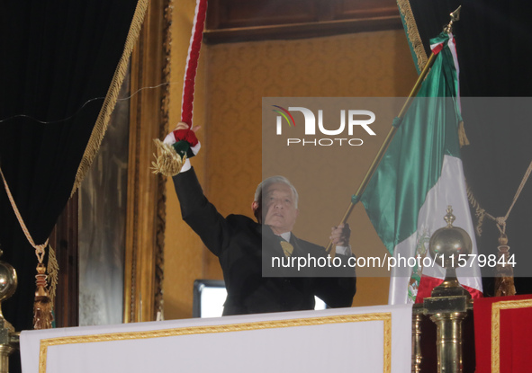 Mexico's President, Andres Manuel Lopez Obrador, waves the Mexican flag and makes his last shout of independence to commemorate the 214th an...