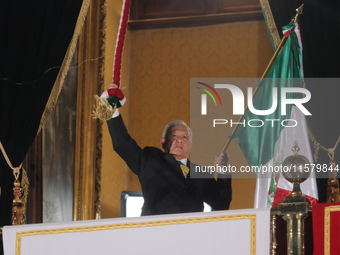 Mexico's President, Andres Manuel Lopez Obrador, waves the Mexican flag and makes his last shout of independence to commemorate the 214th an...