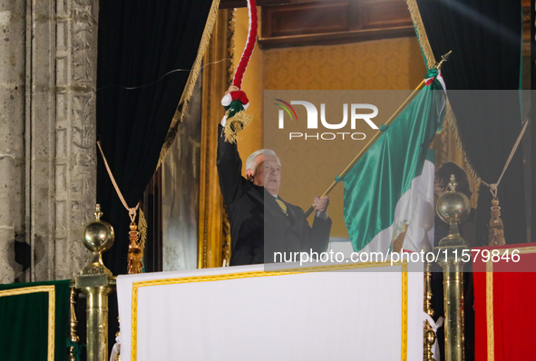 Mexico's President, Andres Manuel Lopez Obrador, waves the Mexican flag and makes his last shout of independence to commemorate the 214th an...