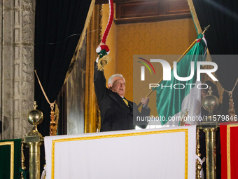 Mexico's President, Andres Manuel Lopez Obrador, waves the Mexican flag and makes his last shout of independence to commemorate the 214th an...