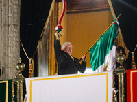 Mexico's President, Andres Manuel Lopez Obrador, waves the Mexican flag and makes his last shout of independence to commemorate the 214th an...