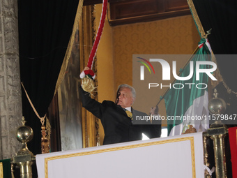 Mexico's President, Andres Manuel Lopez Obrador, waves the Mexican flag and makes his last shout of independence to commemorate the 214th an...