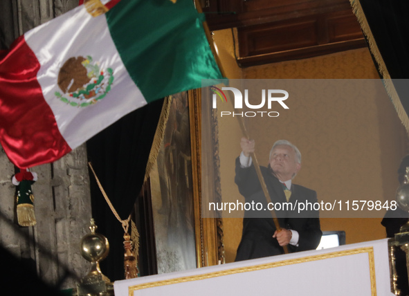 Mexico's President, Andres Manuel Lopez Obrador, waves the Mexican flag and makes his last shout of independence to commemorate the 214th an...