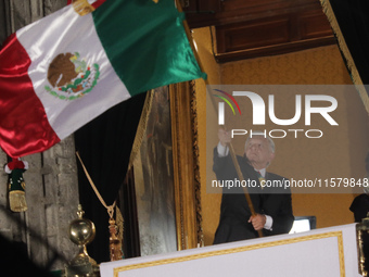 Mexico's President, Andres Manuel Lopez Obrador, waves the Mexican flag and makes his last shout of independence to commemorate the 214th an...