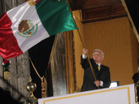 Mexico's President, Andres Manuel Lopez Obrador, waves the Mexican flag and makes his last shout of independence to commemorate the 214th an...