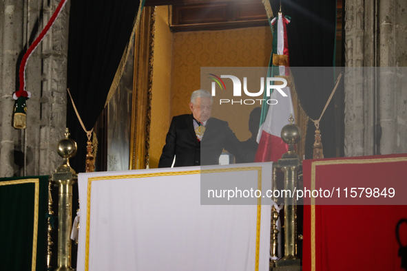 Mexico's President, Andres Manuel Lopez Obrador, waves the Mexican flag and makes his last shout of independence to commemorate the 214th an...