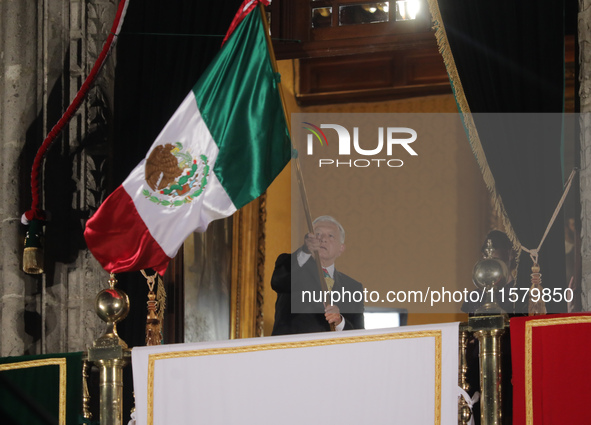 Mexico's President, Andres Manuel Lopez Obrador, waves the Mexican flag and makes his last shout of independence to commemorate the 214th an...