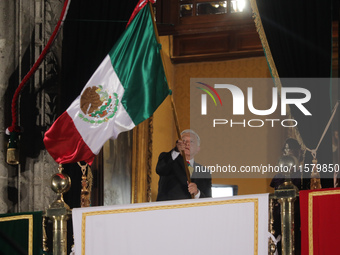 Mexico's President, Andres Manuel Lopez Obrador, waves the Mexican flag and makes his last shout of independence to commemorate the 214th an...