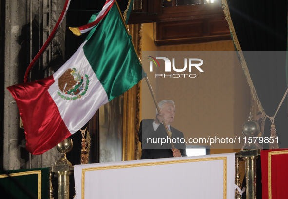 Mexico's President, Andres Manuel Lopez Obrador, waves the Mexican flag and makes his last shout of independence to commemorate the 214th an...