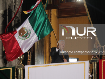 Mexico's President, Andres Manuel Lopez Obrador, waves the Mexican flag and makes his last shout of independence to commemorate the 214th an...