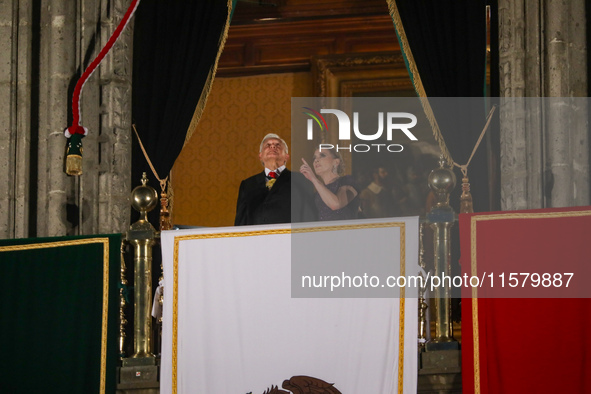 Mexico's President, Andres Manuel Lopez Obrador, accompanied by his wife Beatriz Gutierrez Muller, makes his last shout of independence to c...