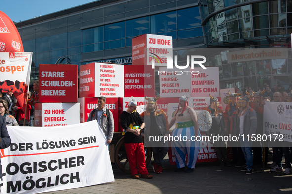 IGM labor union calls for thousands of steel workers to protest in front of Mercatorhall during the national steel summit in Duisburg, Germa...