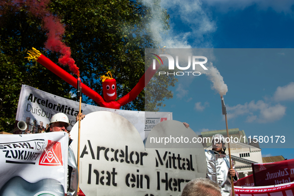 IGM labor union calls for thousands of steel workers to protest in front of Mercatorhall during the national steel summit in Duisburg, Germa...